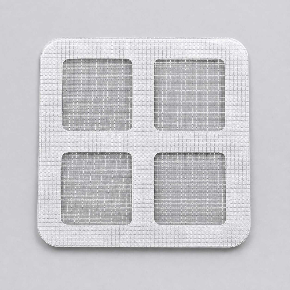 Square white mesh drain hair catcher sticker on a solid background