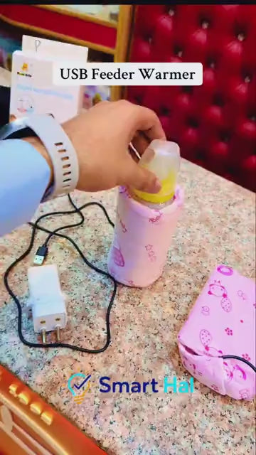 USB feeder warmer sleeve in use for warming a baby bottle
